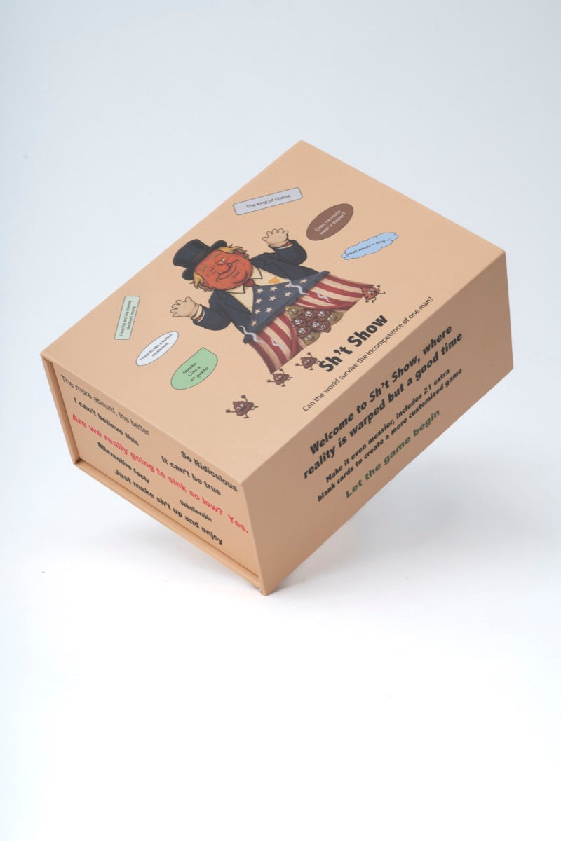 Sh’t Show box with fanned-out cards